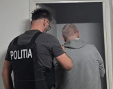 Adus sub escortă din Lituania